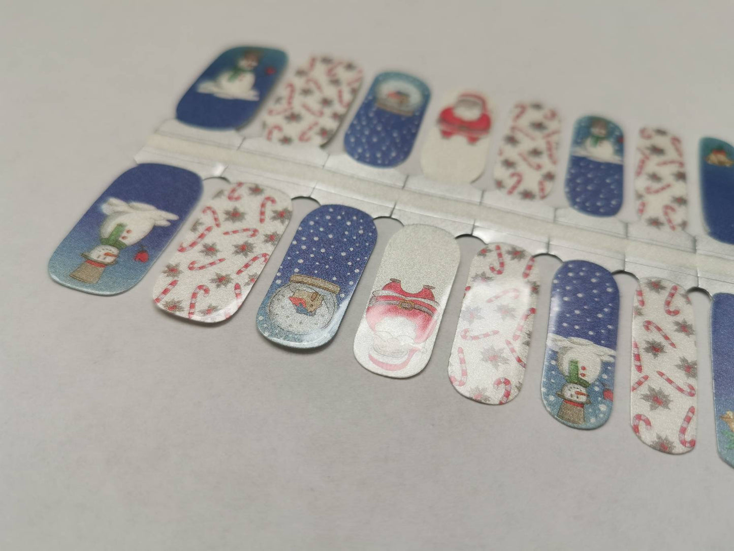 Père Noël rouge et bonhomme de neige Cannes de bonbon Noël bleu et blanc